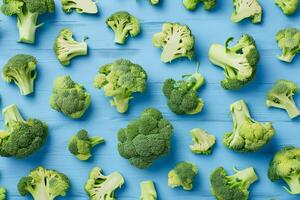 Sliced broccoli on a blue rustic wooden background photo