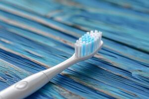 Toothbrush on a wooden surface photo