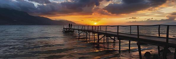 Sunset on the pier at the sea. photo