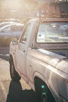 Oldtimer rust pickup at sunset with lensflare photo