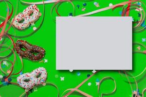 Greeting card for carnival or birthday with cookies in the shape of a mask and mock up photo