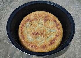 Photo of hardened rice, dry rice on magic com, the rice is dry and then hardened until it turns brownish. burnt rice, crusty rice