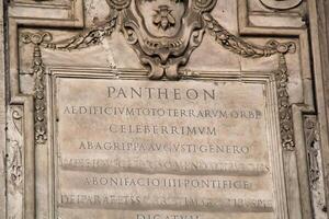 Rome, Italy - September 14 2022 - Inscription Writing on the Wall of Rome Pantheon photo