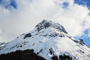 Mountain with Blue Sky and White Clouds in Lech, Austria photo