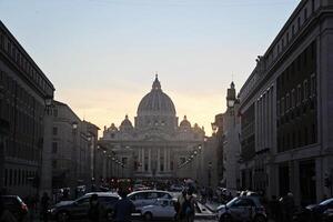 Rome, Italy - September 13 2022 - Vatican City and Saint Peter's Basilica and Square with Traffic and Tourists photo