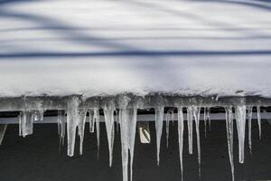 Icicles Hanging from a Rooftop photo