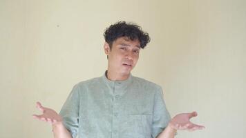 Moslem Asian man why and i don't know pose when Ramadan celebration. The footage is suitable to use for business Ramadhan poster and Muslim content media. video