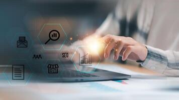 Marketer showing SEO concept ,optimization analysis tools , search engine rankings , social media sites based on results analysis data ,Website Search Optimization ,online marketing strategy photo