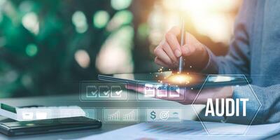 Auditor worker working with document folder ,Management of important document storage of organization ,ERP document system ,quality assessment management With a checklist ,online document database photo