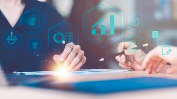 statistical analyst reading graph report and business statistics charts ,Analysis and improvement of corporate strategy ,manage financial and marketing documents ,business growth graph photo