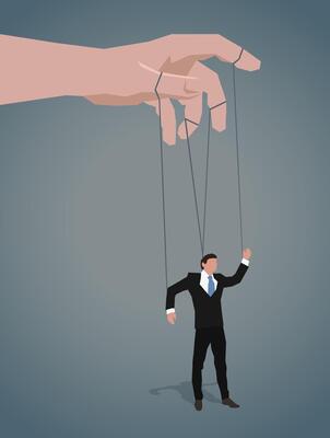 A man in a business suit hangs on the ropes like a puppet.