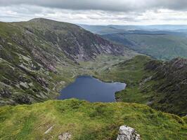 Scenic Mountain View with Lake and Rolling Hills photo