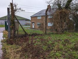 Rural house in wet weather conditions photo