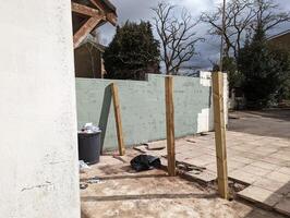 Patio in the process of a fence installation photo