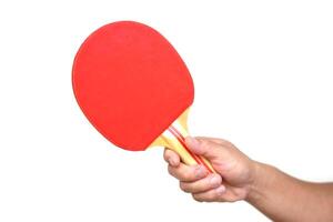 Hand hold red ping pong racket, isolated on white background. Concept, sport equipment. Exercise or workout tool. Competitive game sport. Playing Ping pong photo