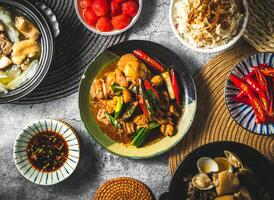 Braised chicken with soy sauce served in plate isolated on grey background top view of assorted taiwan food photo