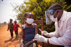 Open air vaccination session in an african village during corona virus pandemic photo