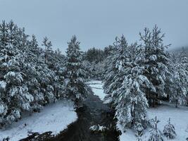 Amazing Cinematic Aerial View On Freezing River. Aerial View Flight Above Frozen Creek Scenic View Of Nature photo