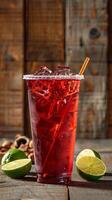 tall plastic cup of red tea with ice photo