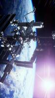 International Space Station ISS floating in orbit above planet earth, vertical video