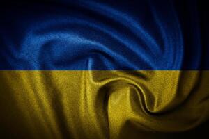 The Ukraine flag consists of two horizontal bands of blue and yellow, symbolizing the sky above and the golden wheat fields below photo