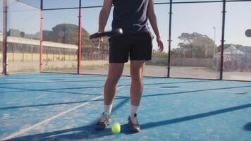 Man Dribbles With Padel Racket In The Blue Court video