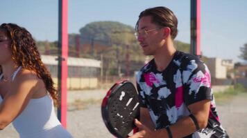 Padel Instructor And Student Practicing In The Field with Racket And Balls video