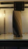 Automated technical 3d printer. Media. 3D printer creates tall object. Large automated 3d printer video
