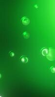 Effect of falling rain on a colorful dream background. Motion. Drops of water or bubbles linking on blurred backdrop. video