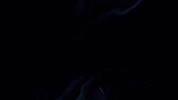 Pink and green lightning on a black background. Motion. Bright flashes of light that quickly light up and go out made in cartoon animation. video