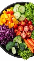 Freshly Cut Vegetables in a Black Bowl for a Healthy Snack photo