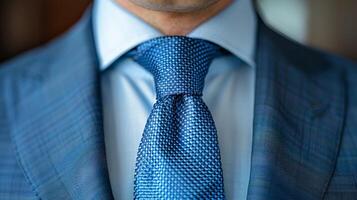 Close-Up of a Blue Silk Tie Worn With a Sharp Suit photo