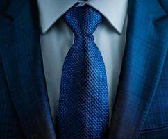 Close-Up View of a Blue Tie and Suit photo