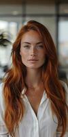 Portrait of a Woman With Long Red Hair in a White Shirt photo