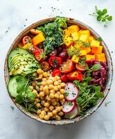 Colorful Vegetable and Chickpea Bowl With Avocado and Radish photo