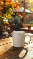 White Coffee Mug on Wooden Table at Outdoor Cafe photo