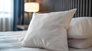 White Pillow on a Made Bed in a Hotel Room photo