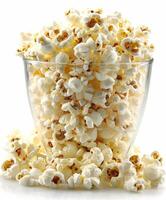 Freshly Popped Popcorn in a Glass Bowl Against a White Background photo