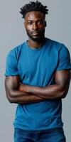 Man With Dreadlocks Wearing Blue T-Shirt and Jeans photo