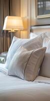 White Pillow on a Soft Fabric Cover in a Hotel Room Interior photo