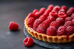 Flaky Raspberry Tart on a Dark Background photo