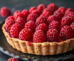 Close Up of a Ripe Raspberry Tart With Flaky Crust photo