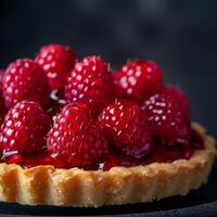 Ripe Raspberry Tart With Flaky Crust on a Dark Background photo