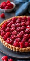 Fresh Raspberry Tart With Flaky Crust on Dark Background photo