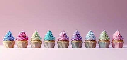 Minimalistic group of holiday cupcakes lined up in row with smooth frosting in light pastel colors photo