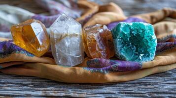 Various polished healing crystals like citrine, malachite, selenite on a silk cloth. New age banner photo