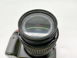 an old nikon d3200 dslr camera with kit lens isolated on white background, Indonesia, 28 May 2024. photo