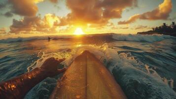 Surfer Paddling on Surfboard Towards the Waves at sunset. POV summer photo, first-person perspective photo