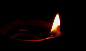 Traditional oil lamp on dark background with copy space. photo