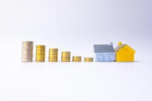 Colorful house and coins using as property and finance concept photo